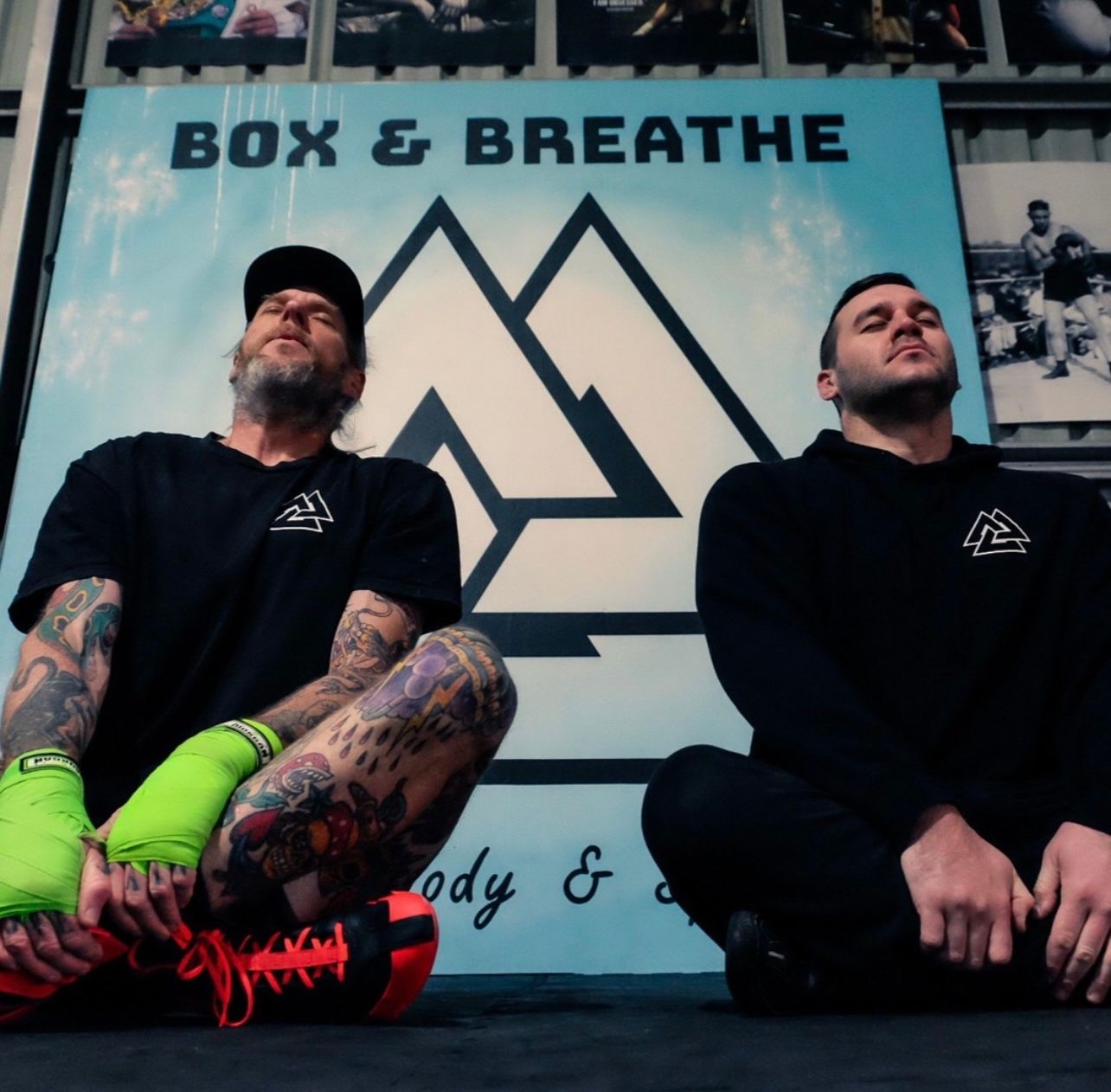 Two members sitting in a breathwork session under the Box & Breathe banner