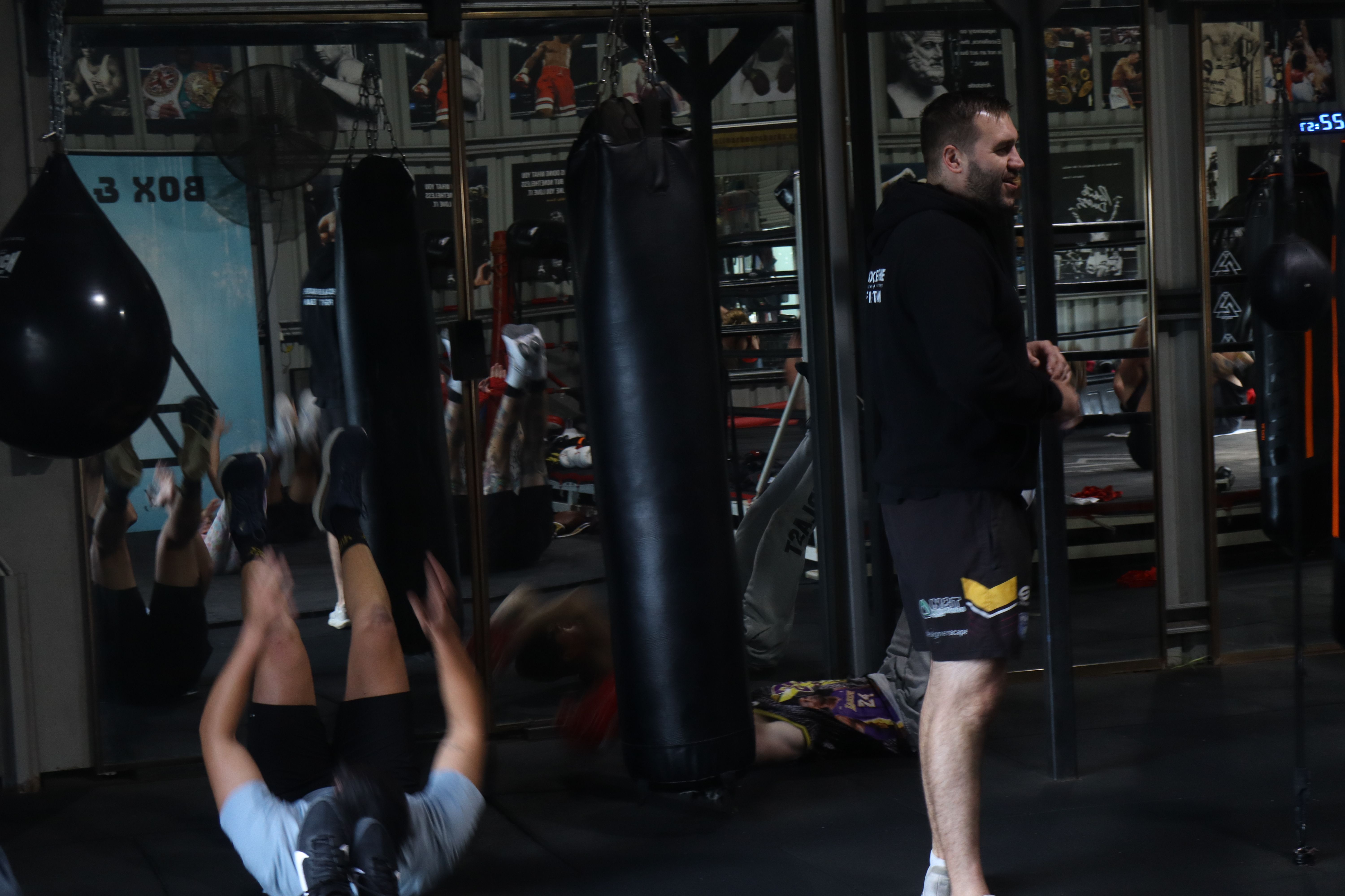 Members doing core conditioning on the mat