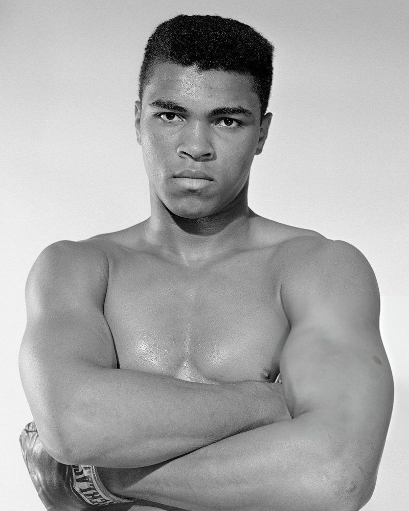 Muhammad Ali, arms folded, gloves on, 1962