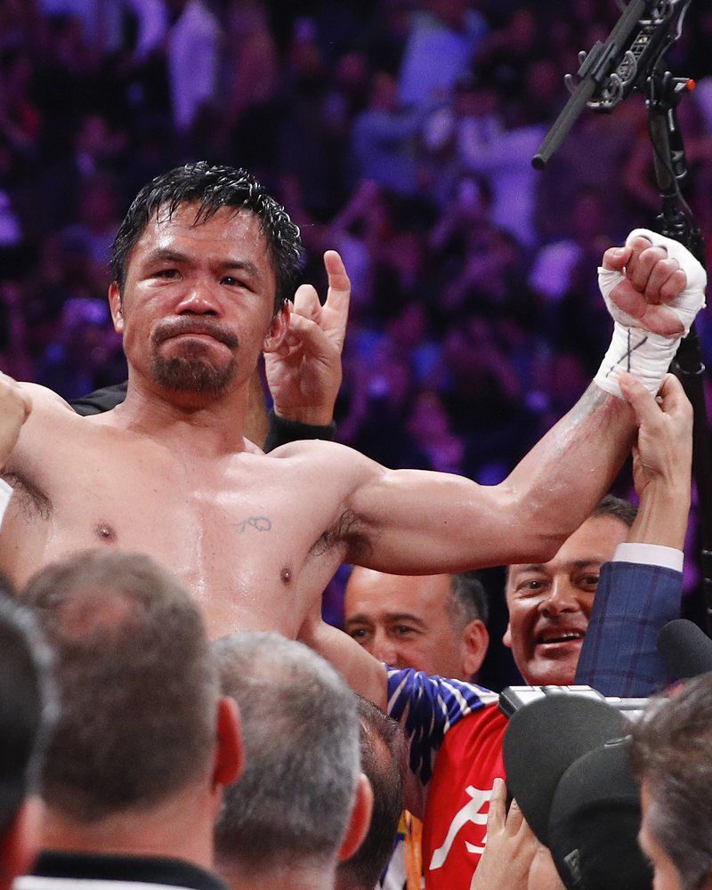 Manny Pacquiao, fists up, after beating Keith Thurman, 2019