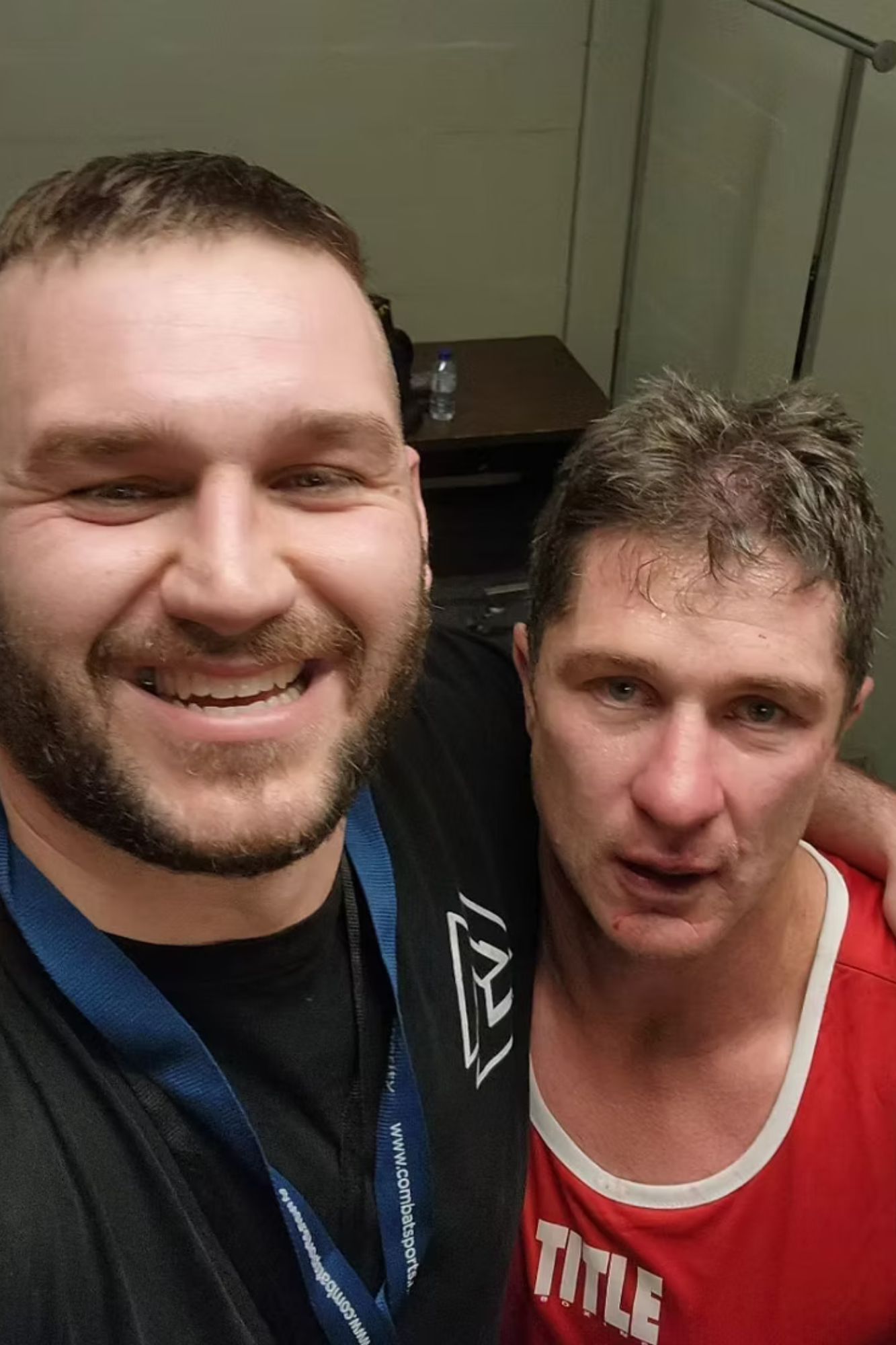 Ben taking a selfie with a boxer in a red singlet