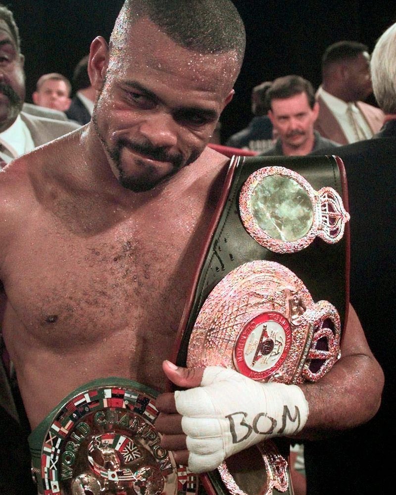 Roy Jones Jr with his WBC and WBA belts