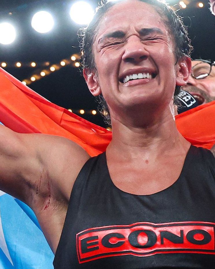 Amanda Serrano celebrating with the Puerto Rico flag
