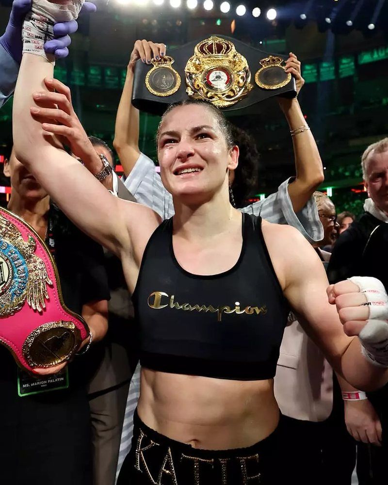 Katie Taylor celebrating with her belts